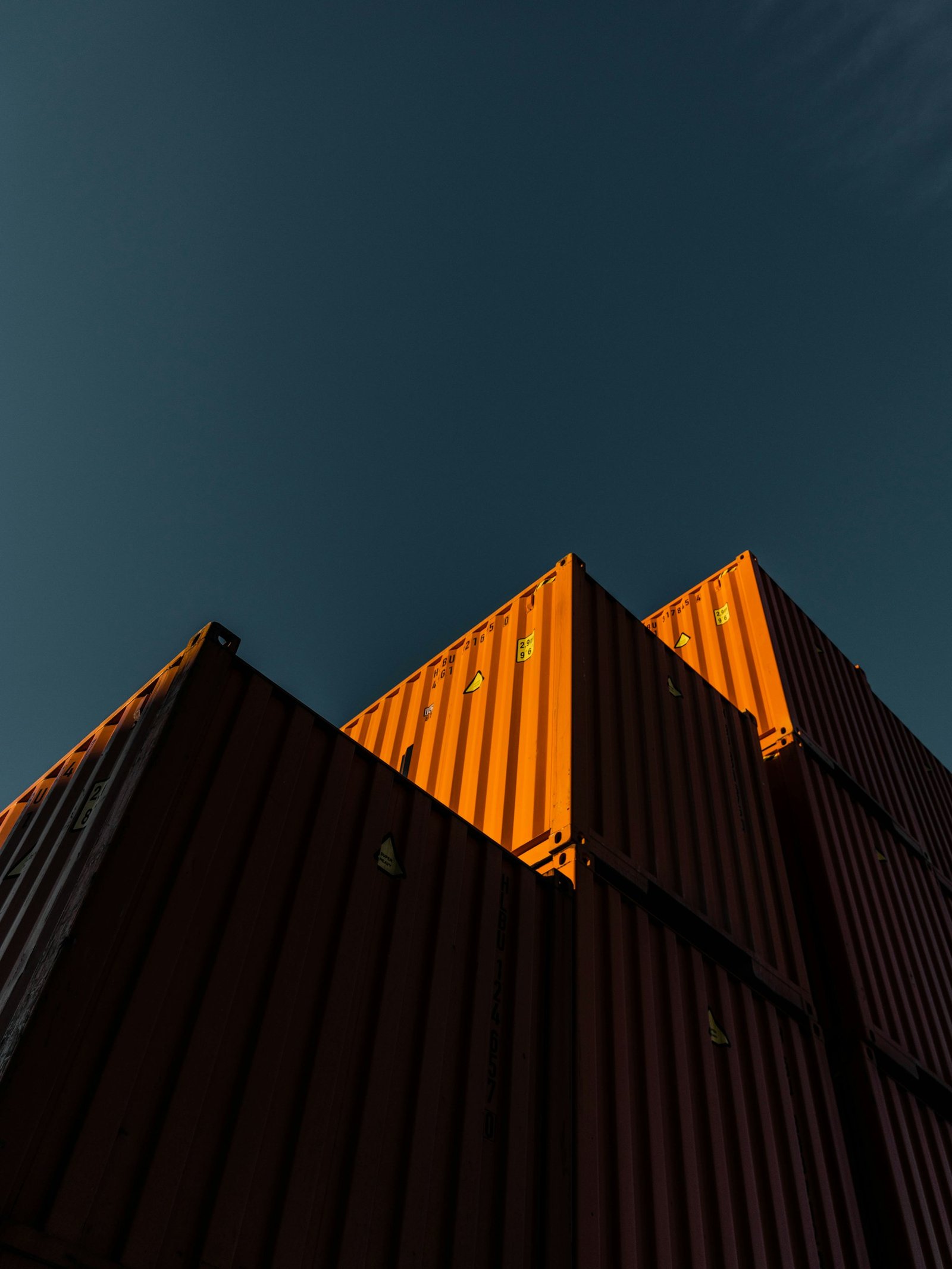 Stacked orange shipping containers